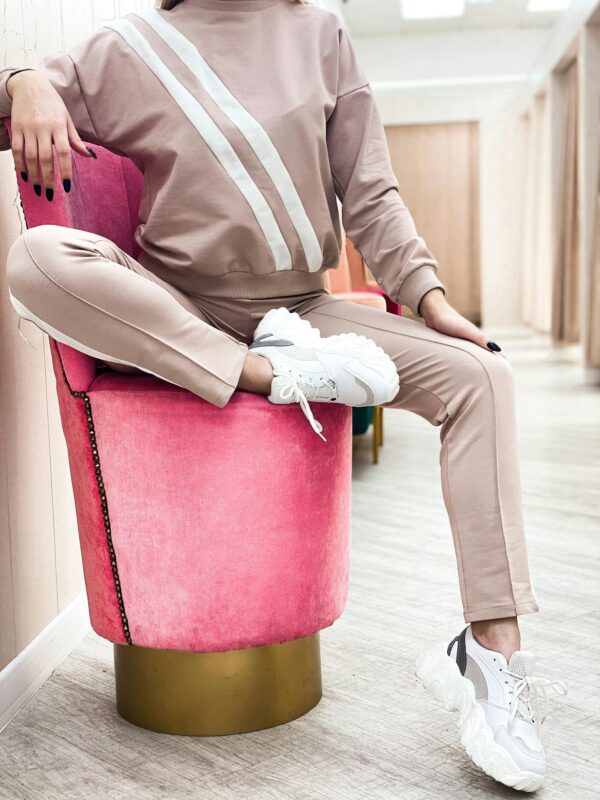 Stylish woman sitting on design armchair